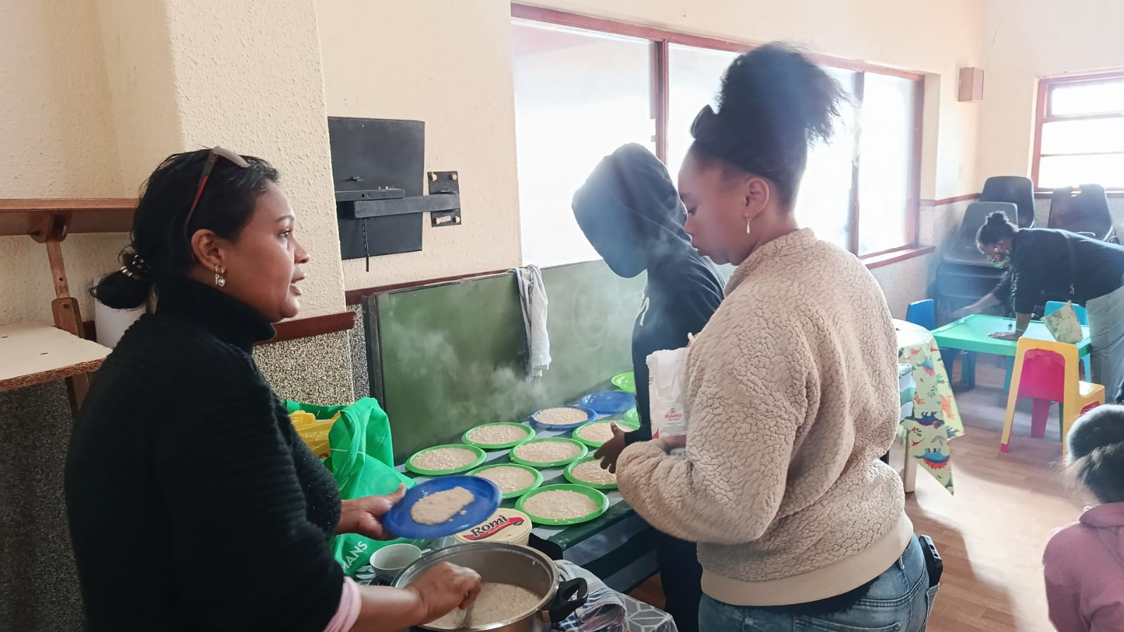 Volunteers preparing meals for the community